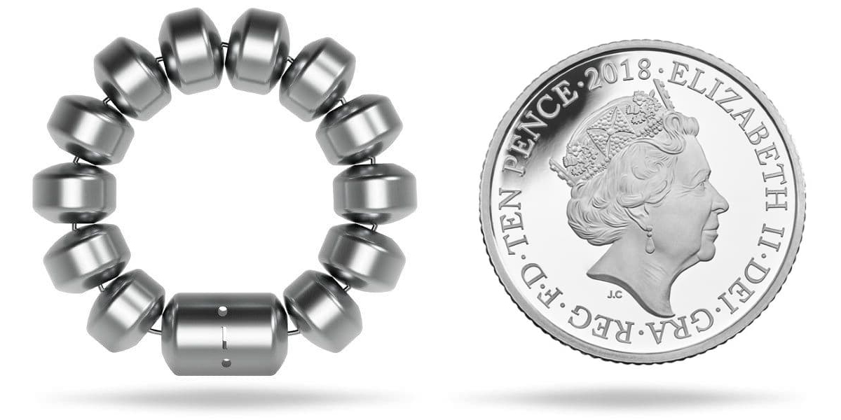 A LINX device for reflux alongside a 10p coin, showing their similar relative size